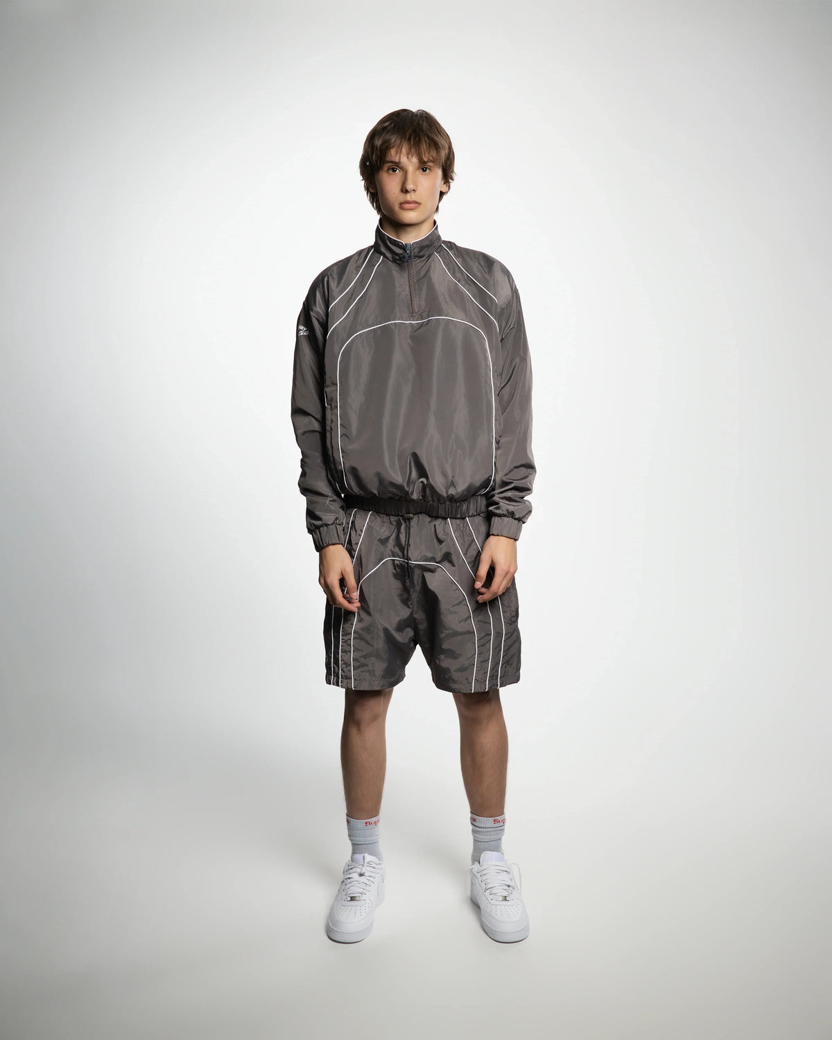 “RADIANT AURA” NYLON TRACK JACKET (SHADOW GREY)